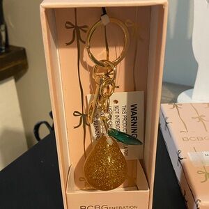 BCBGeneration NWT Gold Glitter Pear Keyring Bag Charm with Green Leaf Accent